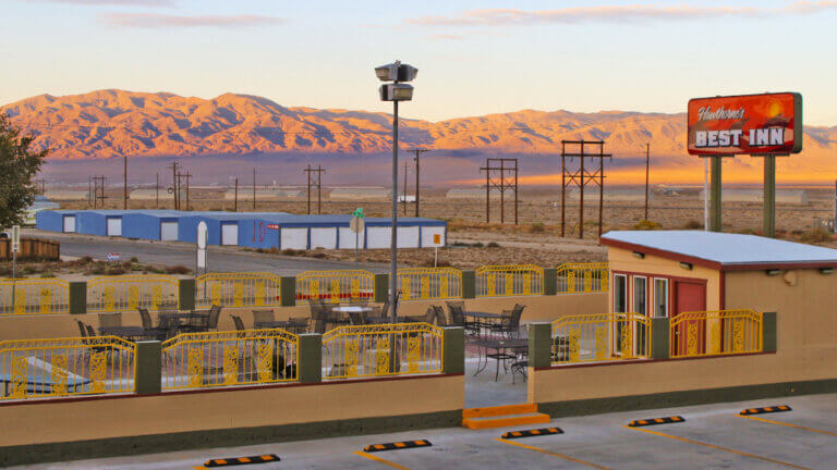 outdoor dining area with mountains in background