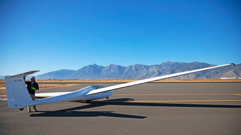 soaring nv glider parked on runway