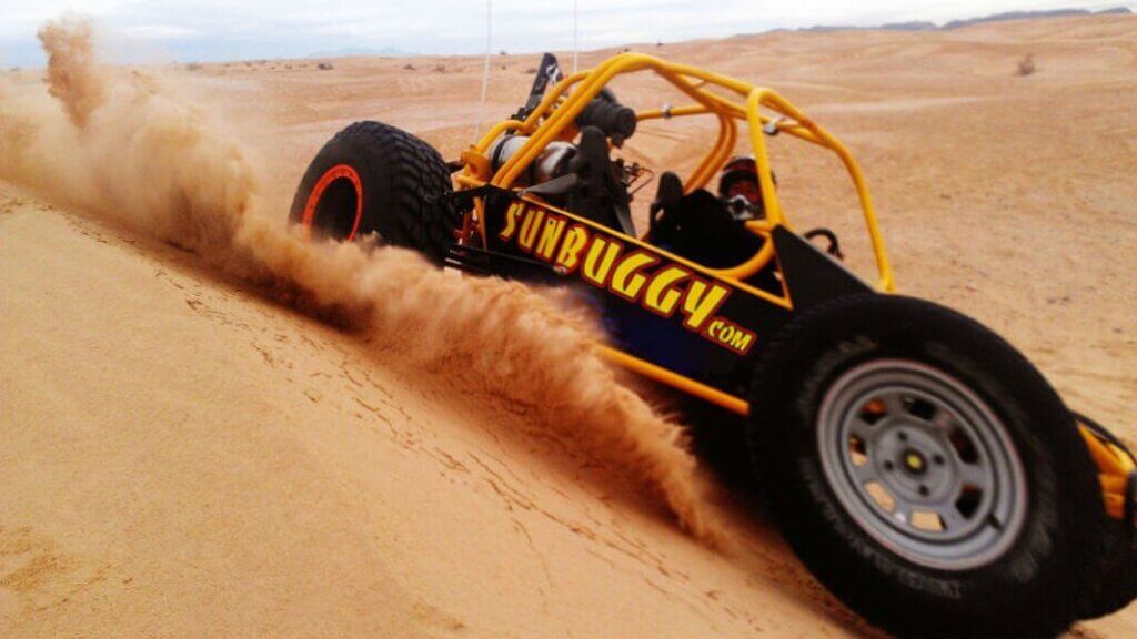 dune buggy kicking up sand outside of las vegas