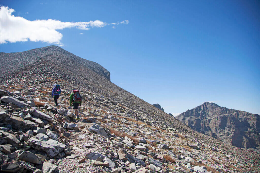 people climbing a rocky mountain in great basin national park