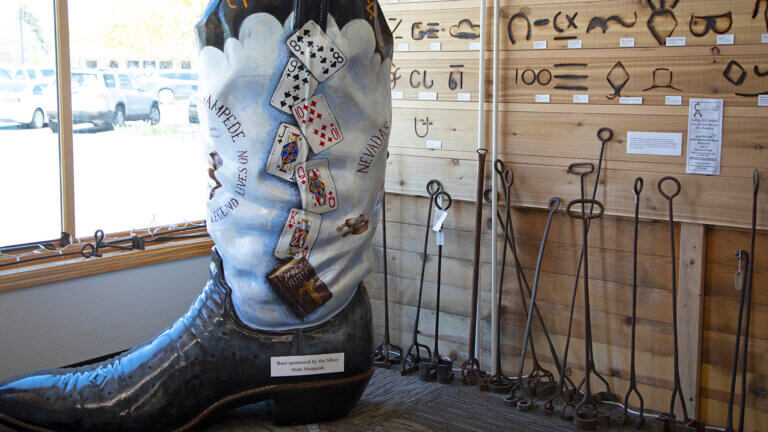 cowboy boot decoration with poker cards on it