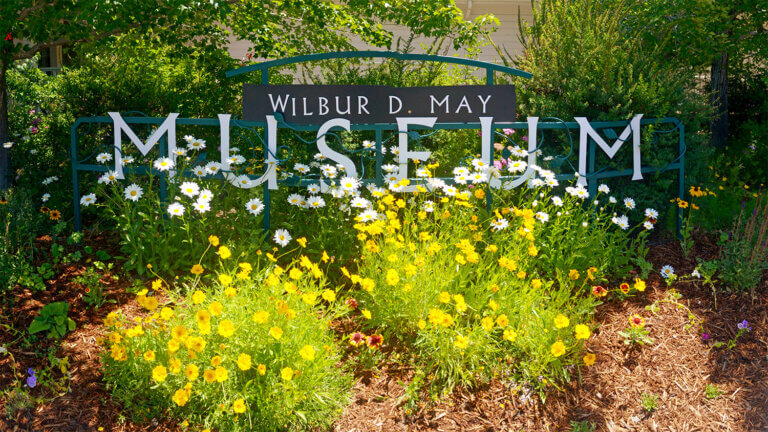 the wilbur d may museum sign