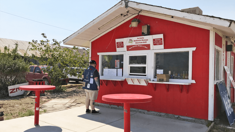 red wall and tables of la casita