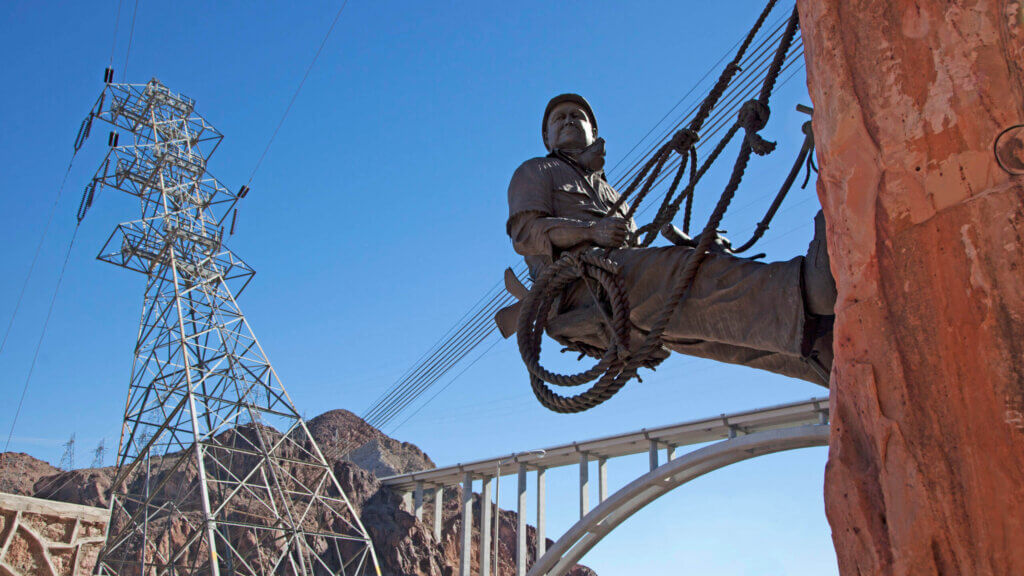 statue of a worker repelling down the hoover dam