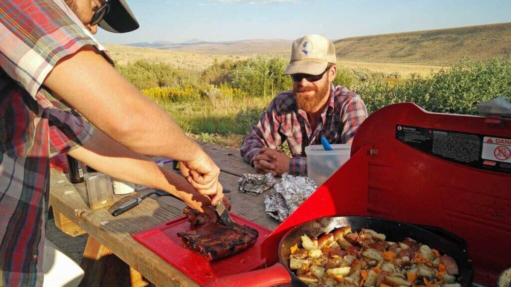 people cooking at campground