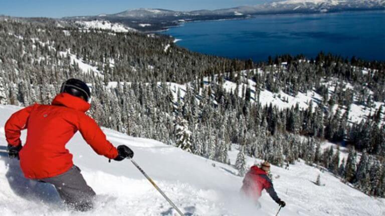 skiers in powder at homewood