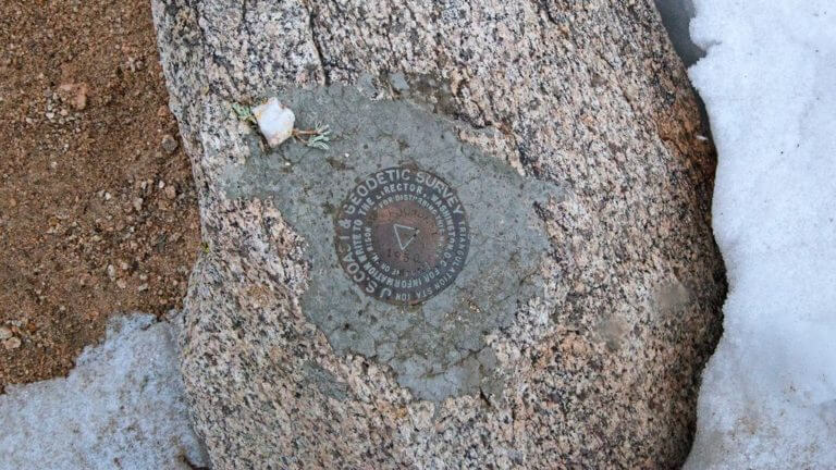 survey logo on rock