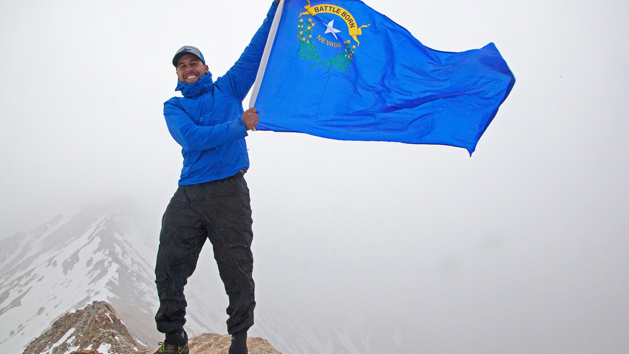 man holding battle born flag