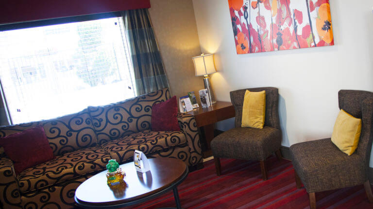 living area in a room at the best western fallon inn and suites