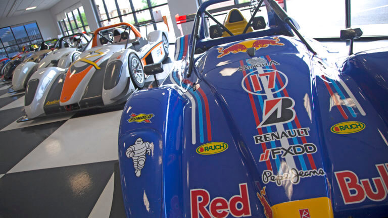 race cars on display inside the spring mountain motor resort and country club
