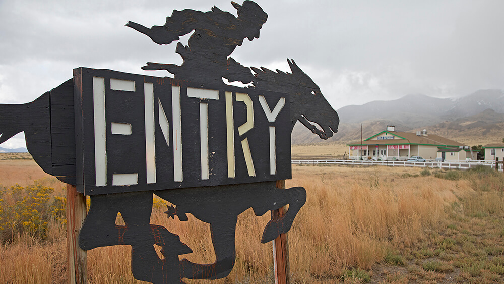 entry sign with a cowboy riding a horse at cold springs station