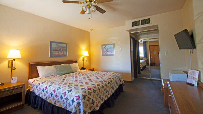 single bed in a room at the el rancho boulder motel
