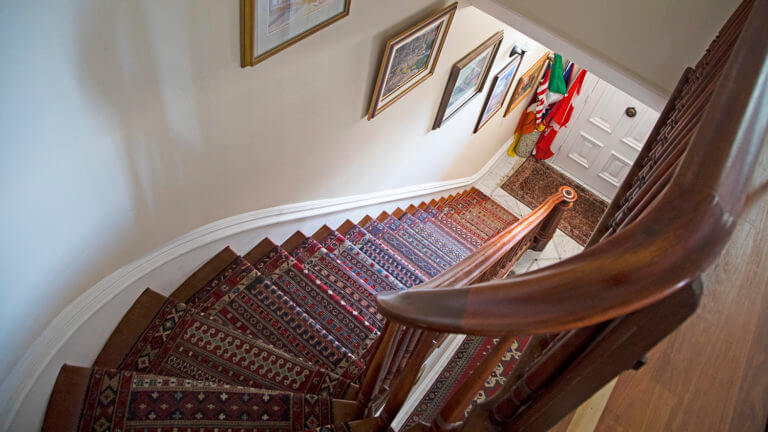 curving staircase at the cobb mansion bed and breakfast