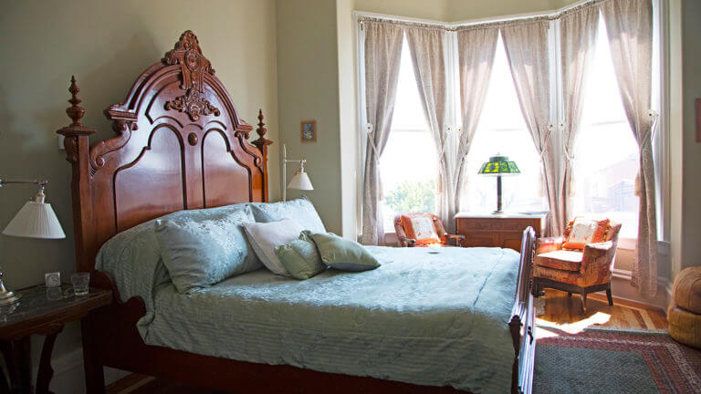 bed view of a room inside the cobb mansion bed and breakfast