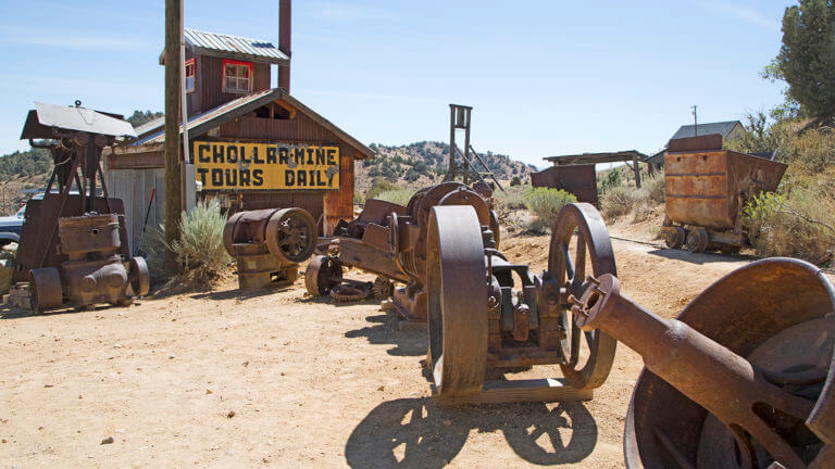old mining supplies and tour sign