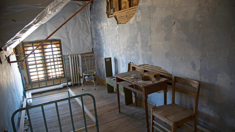 small room with bed and desk at saint marys art center