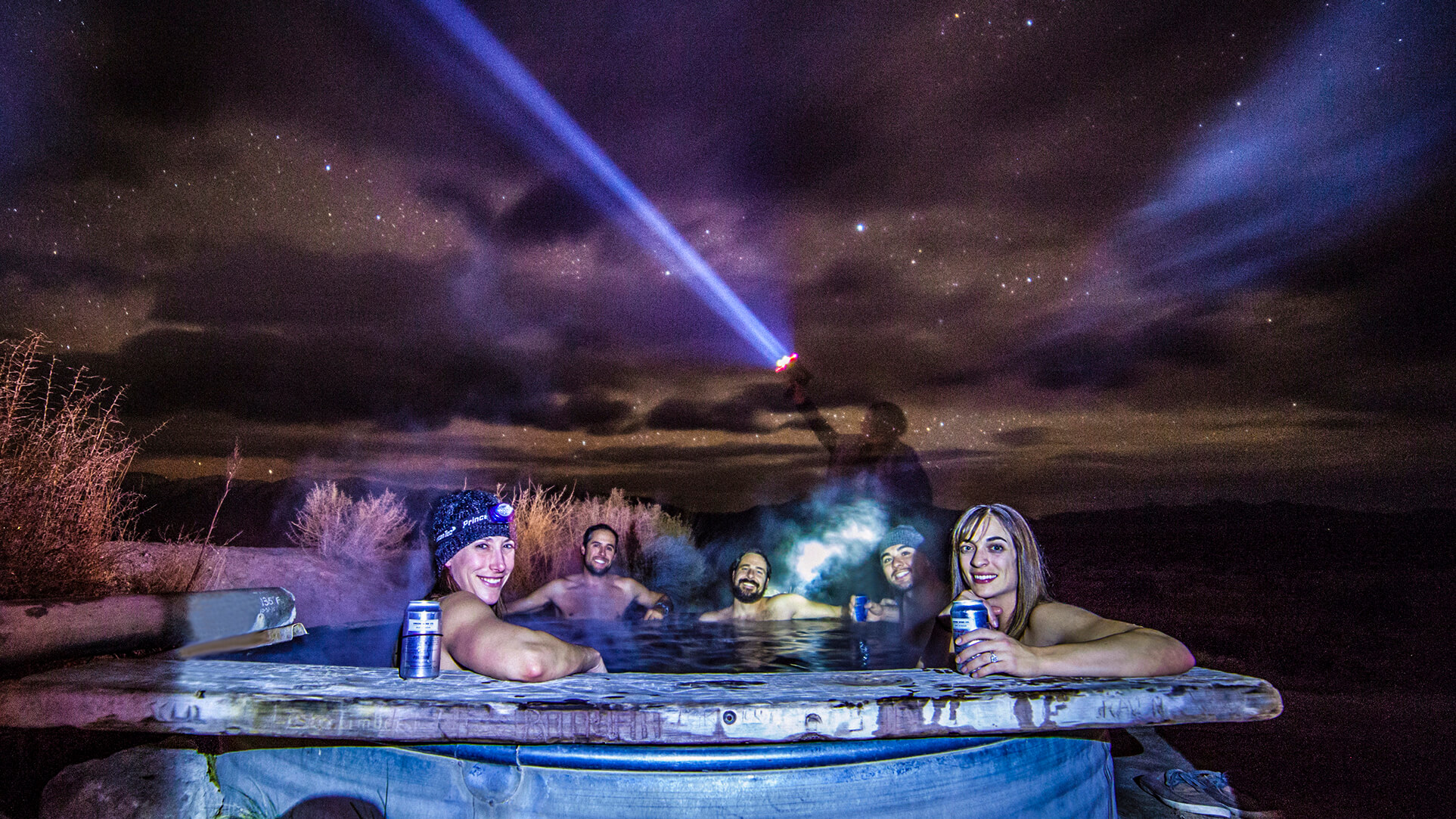 five people soaking in the austin hot springs