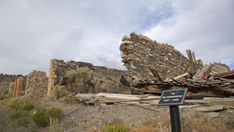 sign in front of ruins