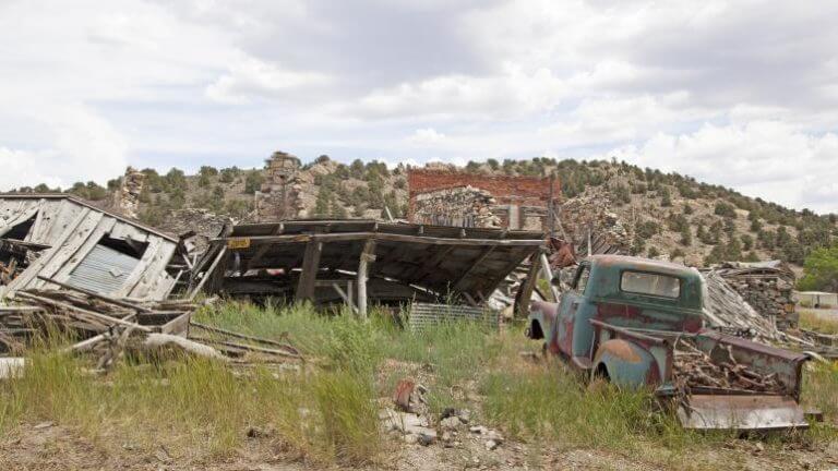 broken down car and building