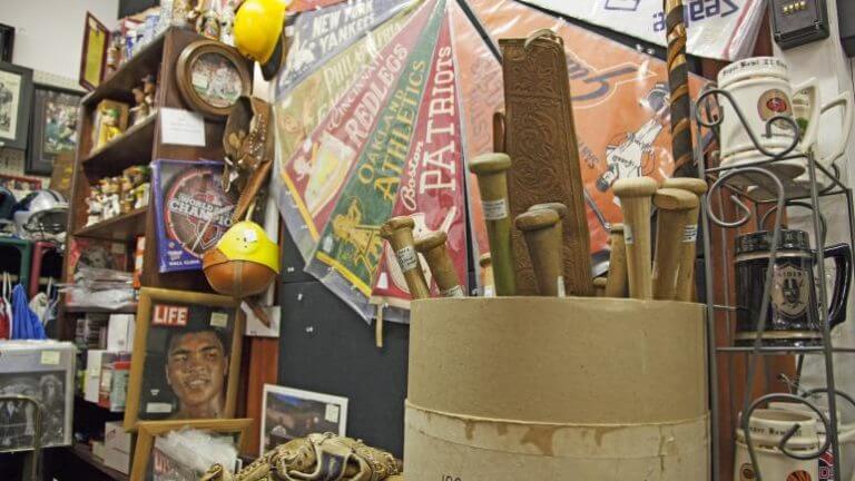 bucket of baseball bats and assorted memorabilia