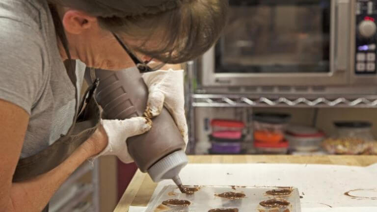 woman making sweets at the chocolate shoppe