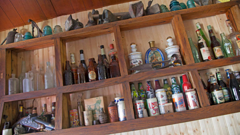 empty bottles displayed on a wall