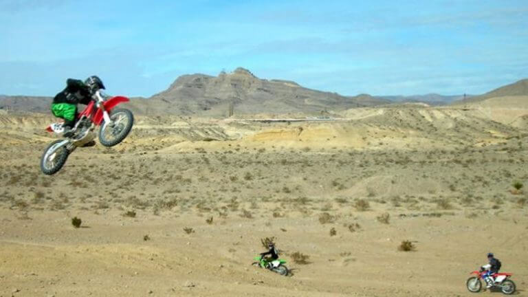 dirtbike catching air in nellis dunes