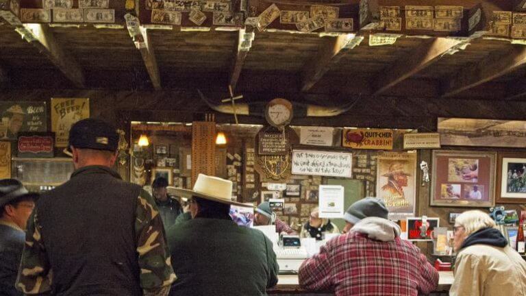 guests sitting at the bar top of the paradise valley saloon