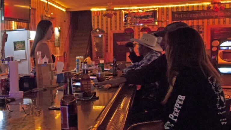 guests inside the the alamo club & liquor outlet