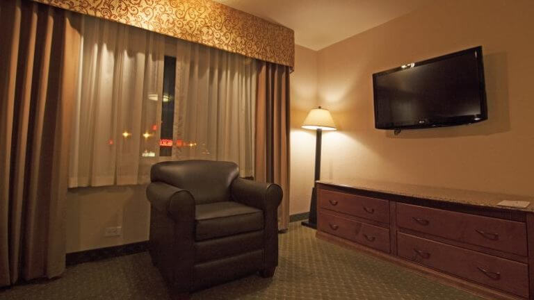 lounge chair in a guest room at ramada elko hotel