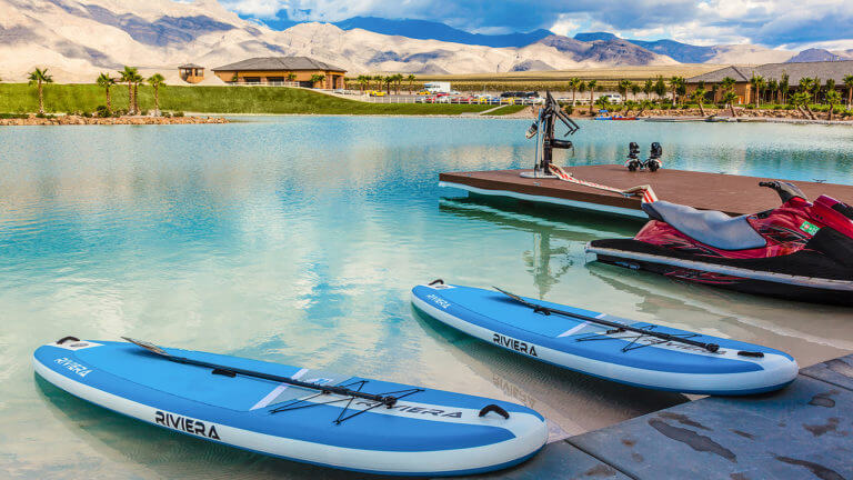 paddle boards and a jet ski docked