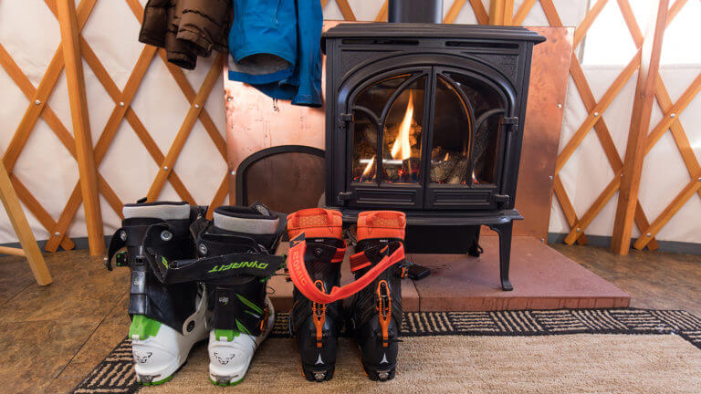 keep your boots warm in front of the fire at ruby yurts lodge