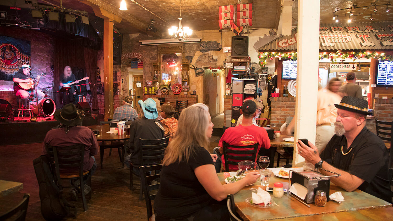 people eating at red dog saloon