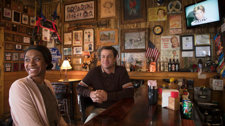 two people sitting at the bar top at happy burro