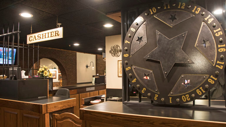 cashier stand and roulette wheel at cellblock steakhouse