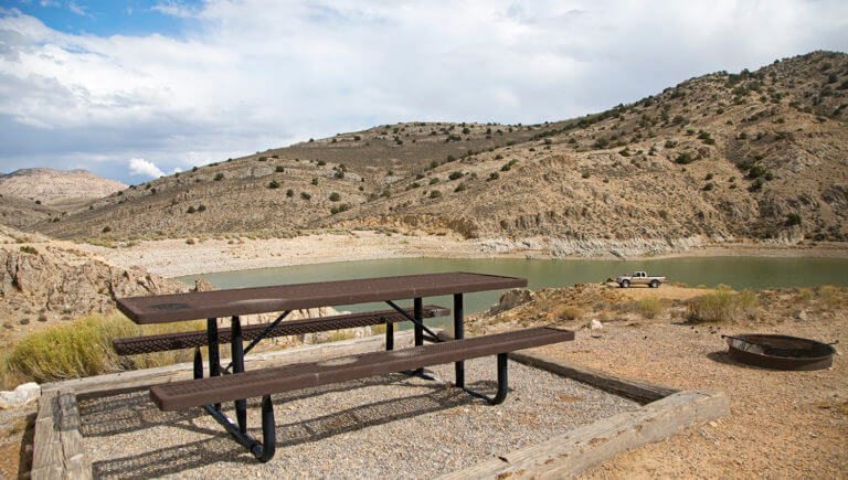 table near reservoir