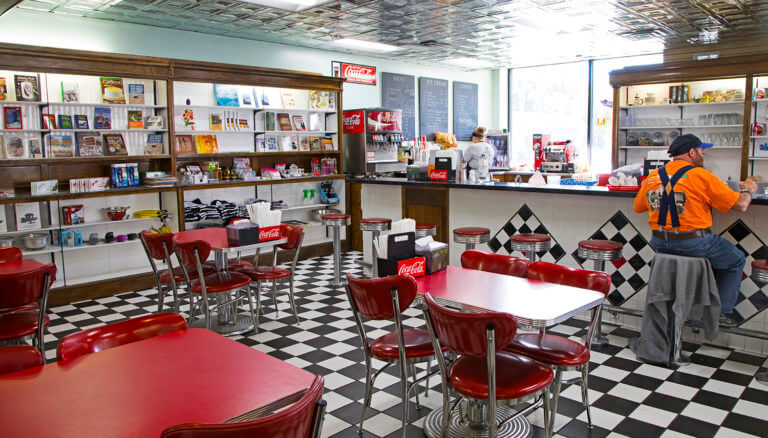 guest sitting at bar in downtown elys old fashion diner