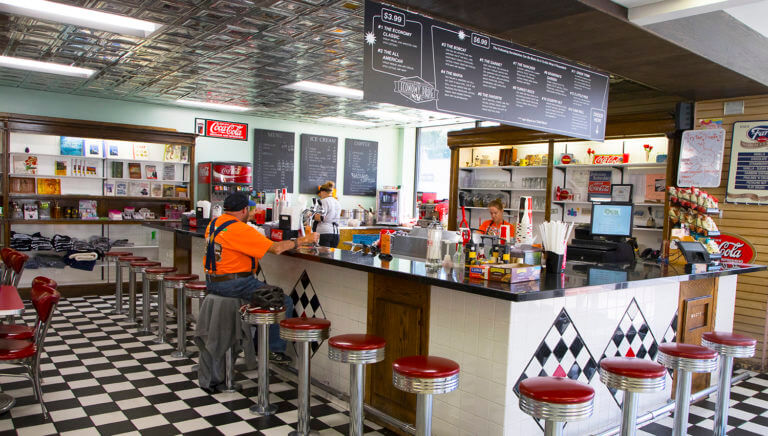 old fashion diner guest in orange shirt