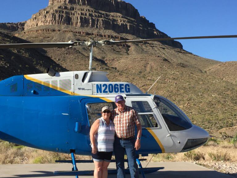 Couple in front of Helicopters