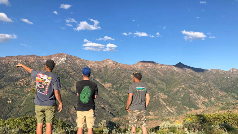 three people overlooking mountains in jarbidge nevada