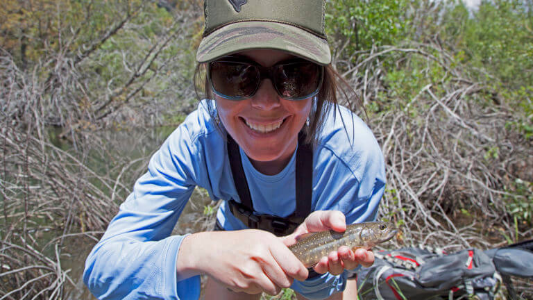 woman holding fish in the jarbidge wilderness