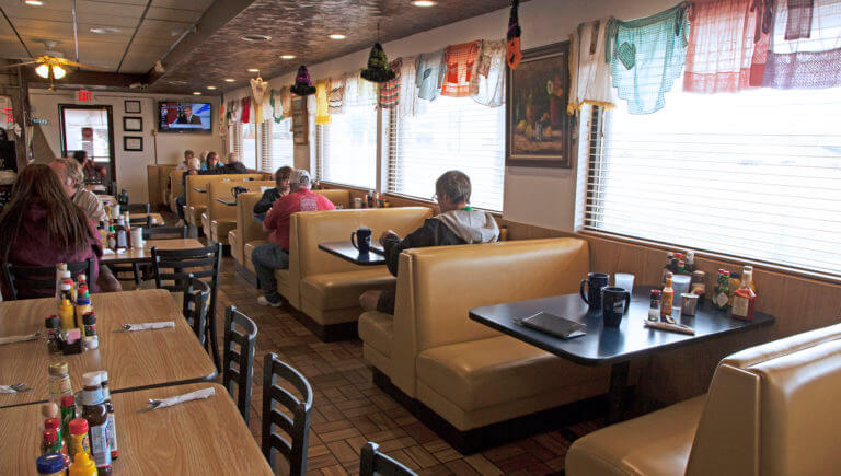 diners sitting at booths in bellas restaurant