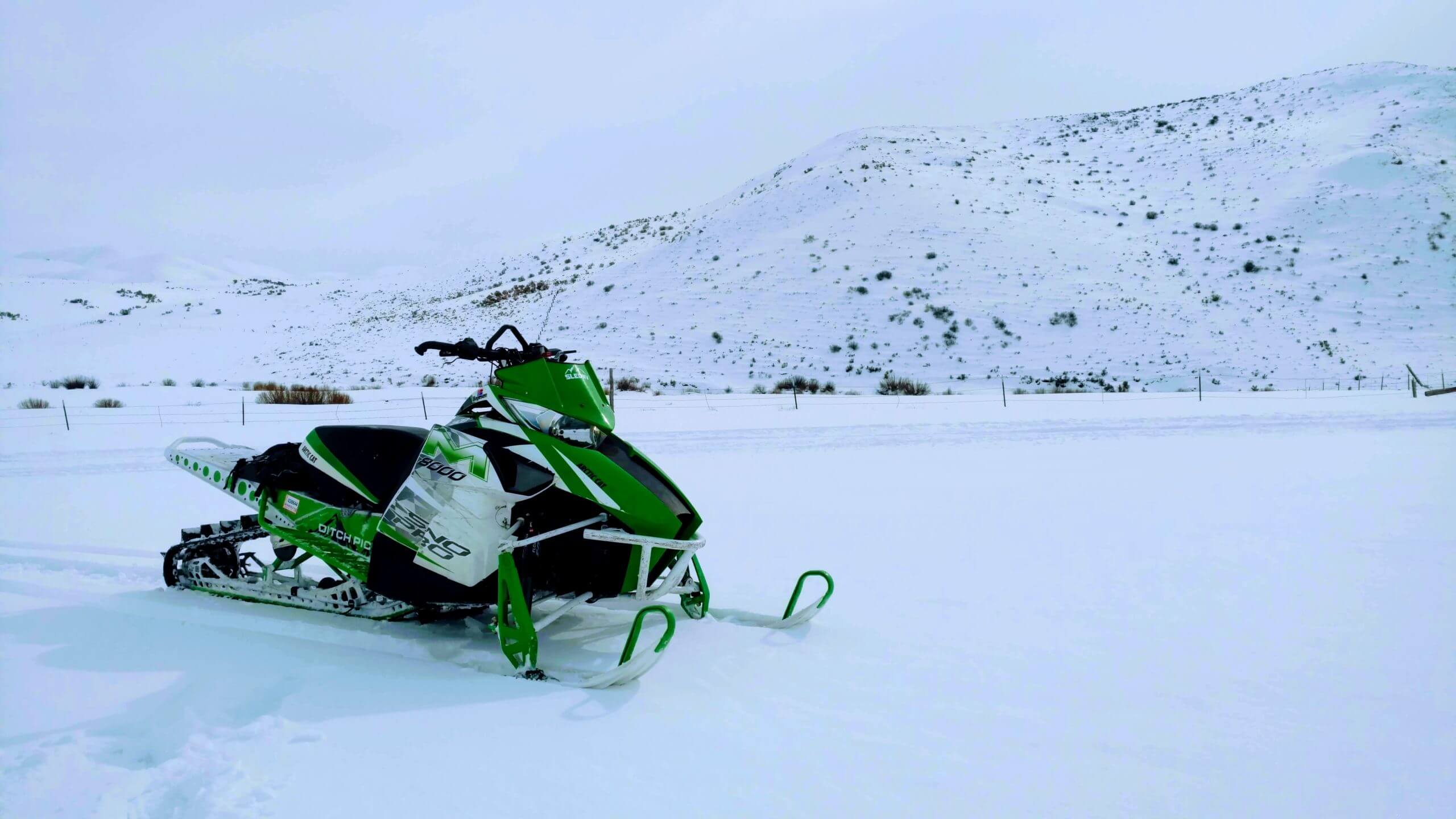 green slednv snowmobile