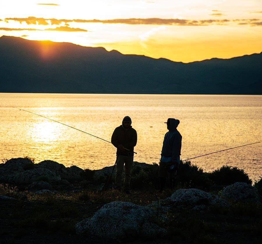 silhouette of two fishermen in nevada