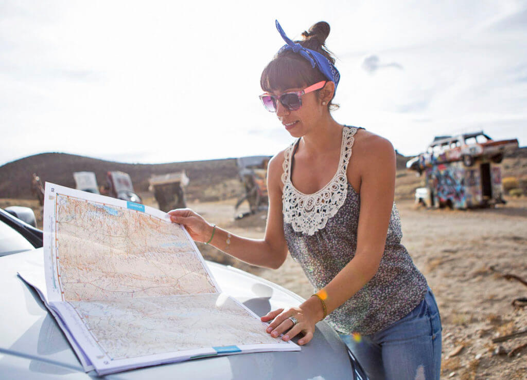 woman inspecting a paper map