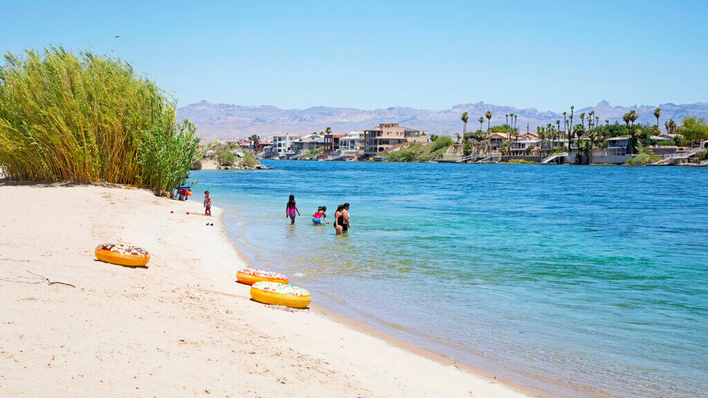 family plays in the water at the big bend of the colorado state recreation area