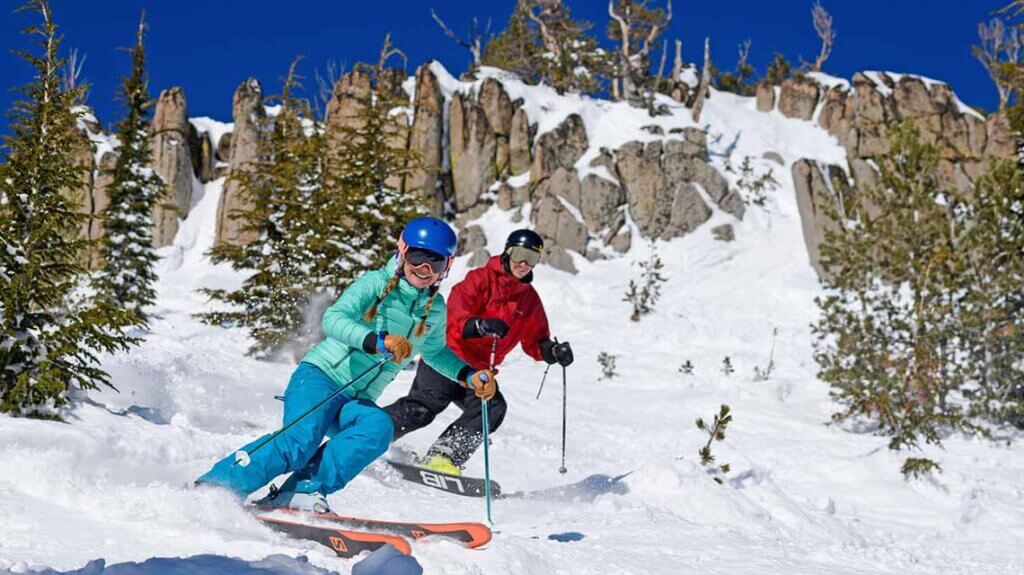 couple skiing at mt rose ski resort in lake tahoe
