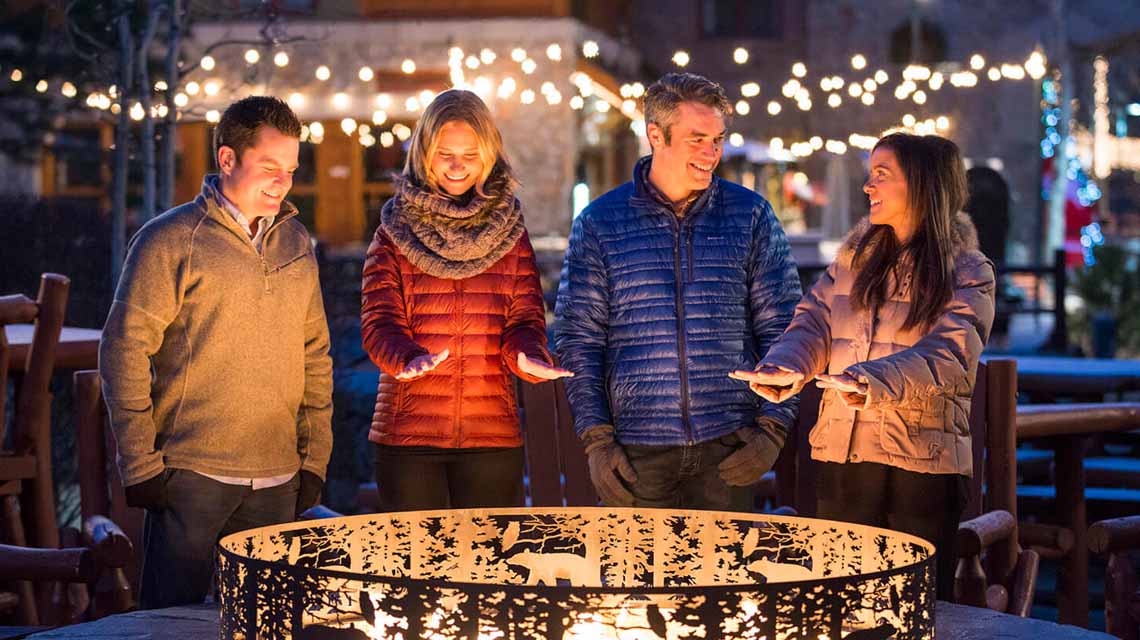 group around firepit at heavenly village in lake tahoe