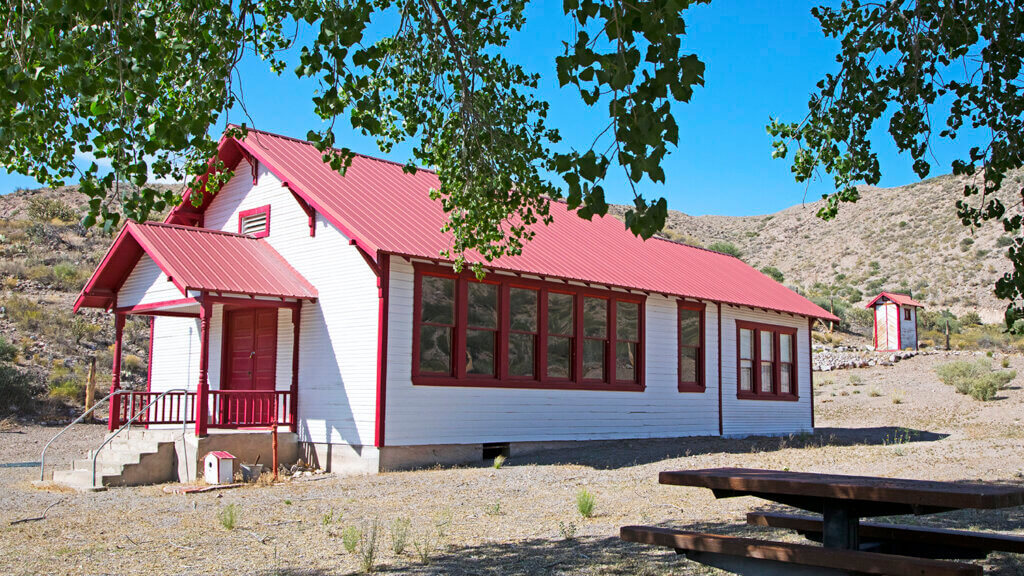 red trim schoolhouse in rainbow canyon