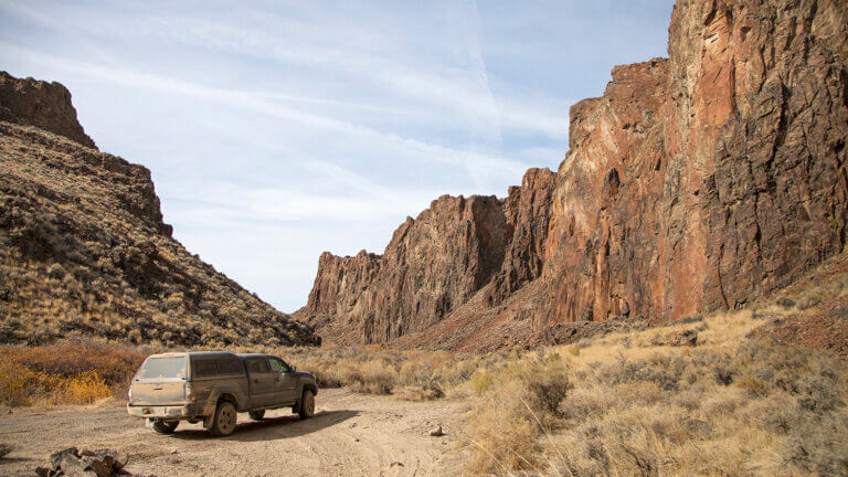 truck sitting in front of high rock canyon